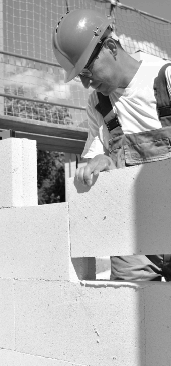 Bricklayer working on building a wall