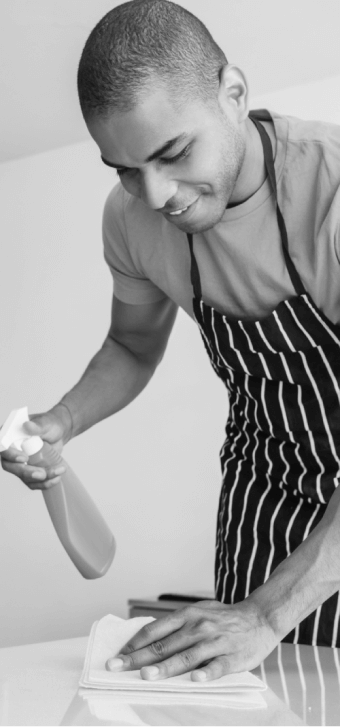 Man cleaning a table