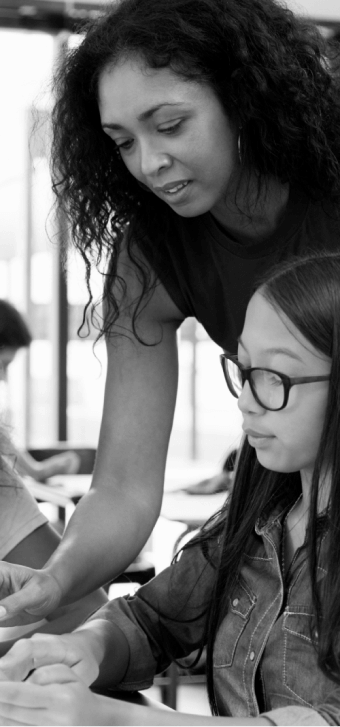 Teacher helping a student at a school